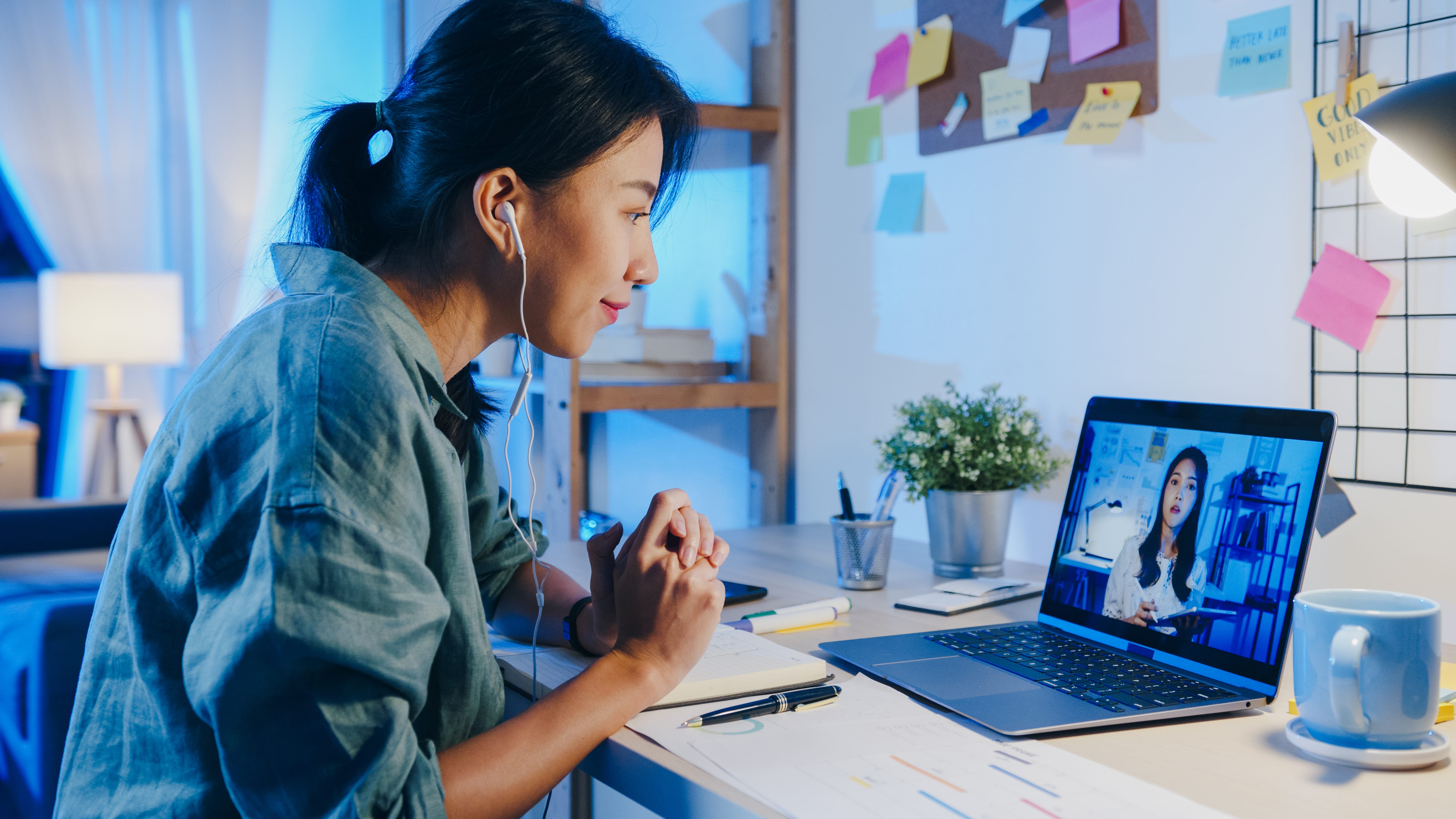 asia-businesswoman-using-laptop-talk-colleagues-about-plan-video-call-meeting-living-room-min.jpg