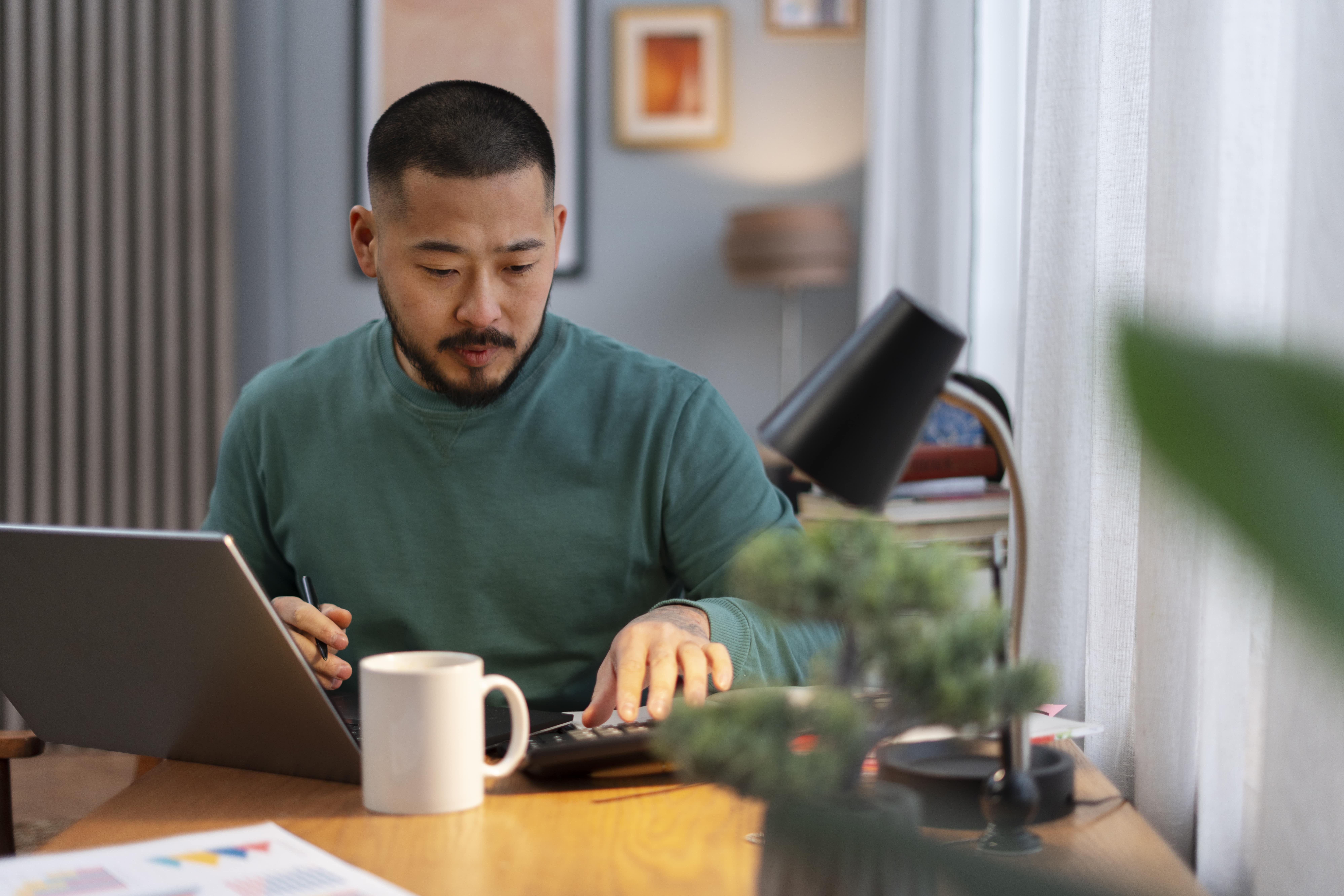 medium-shot-man-working-from-home-min.jpg
