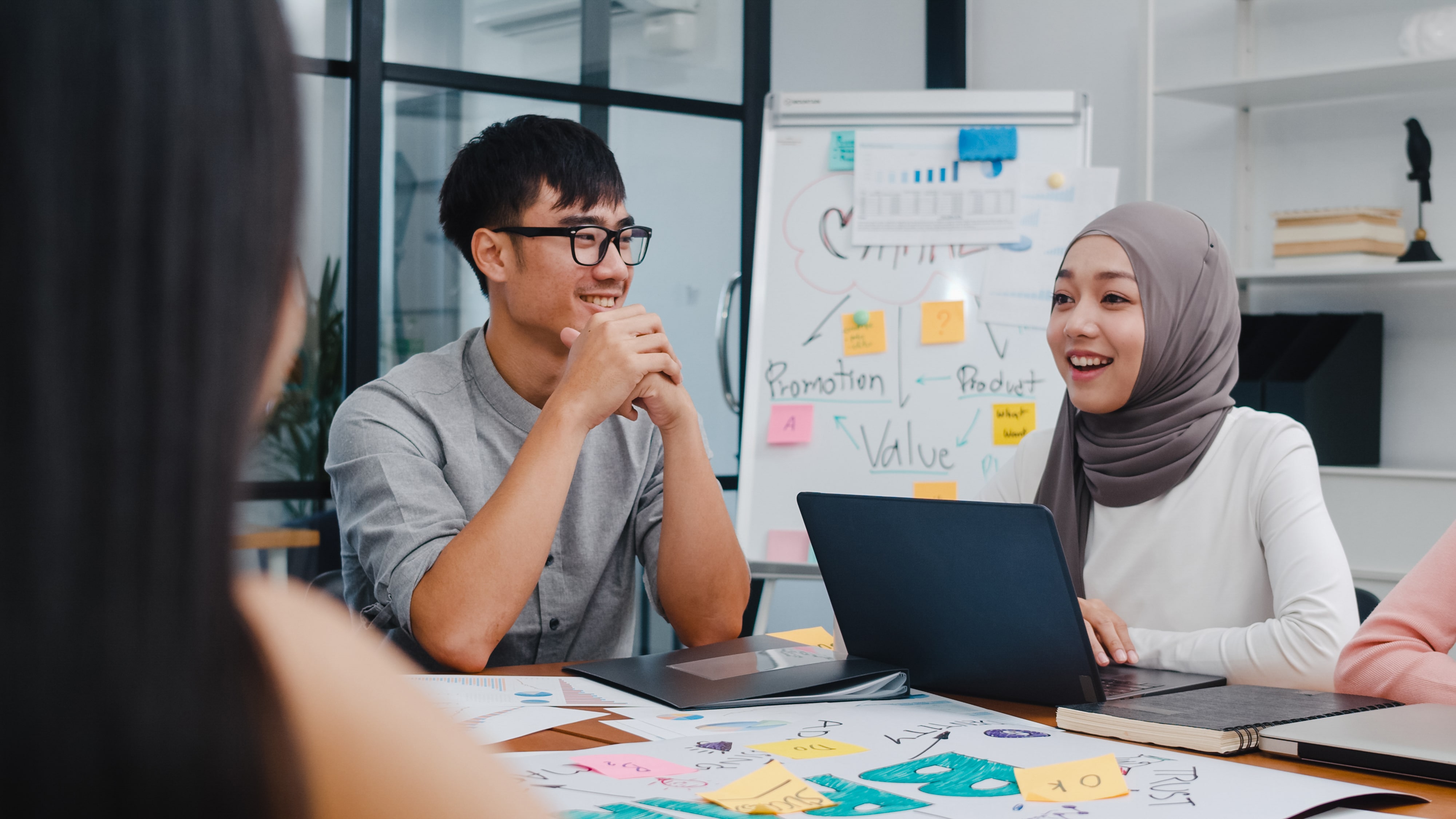 multiracial-group-young-creative-people-smart-casual-wear-discussing-business-brainstorming-meeting-ideas-mobile-application-software-design-project-modern-office-min.jpg