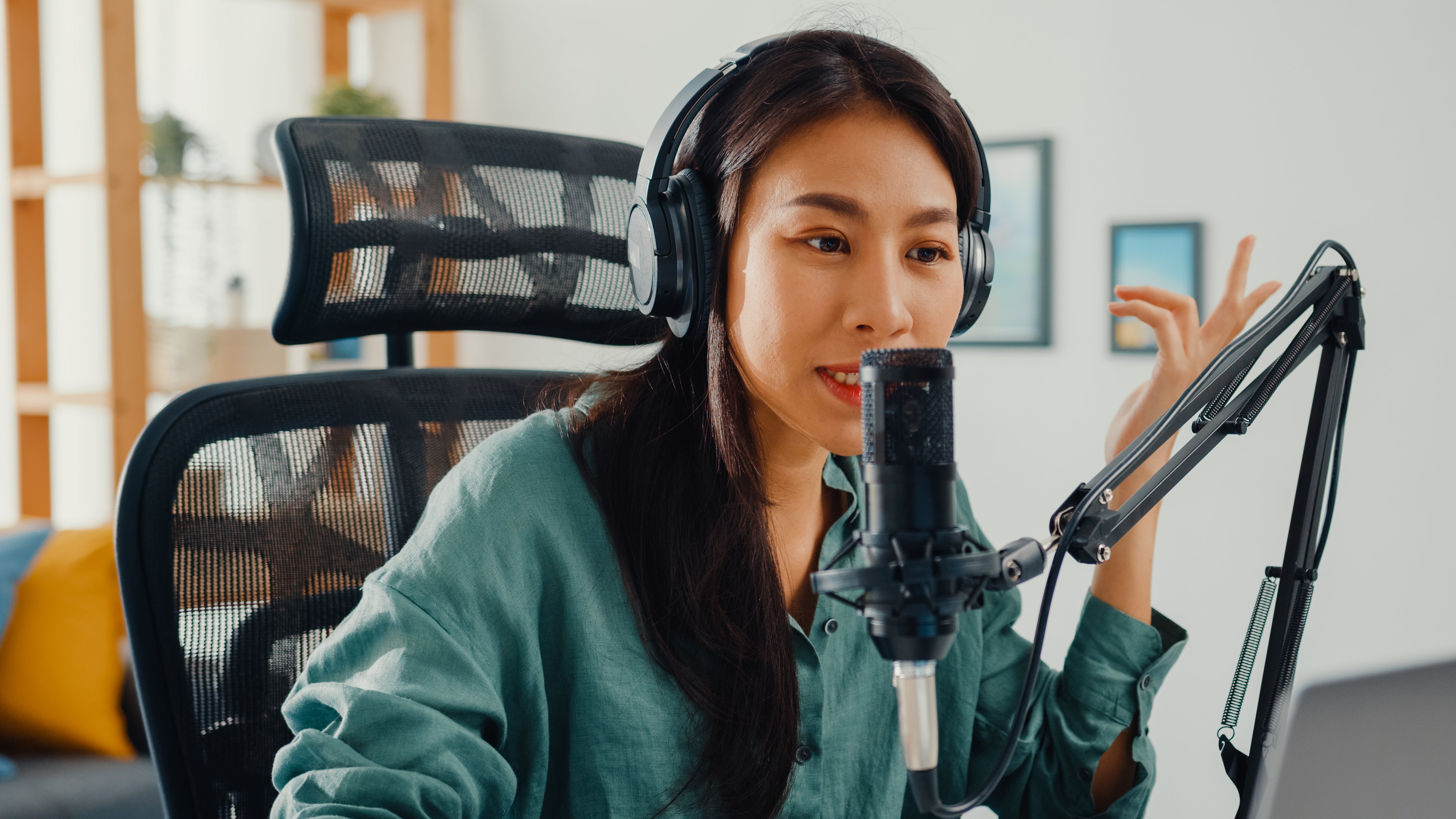 happy-asian-girl-recording-podcast-her-laptop-computer-with-headphones-microphone-min.jpg