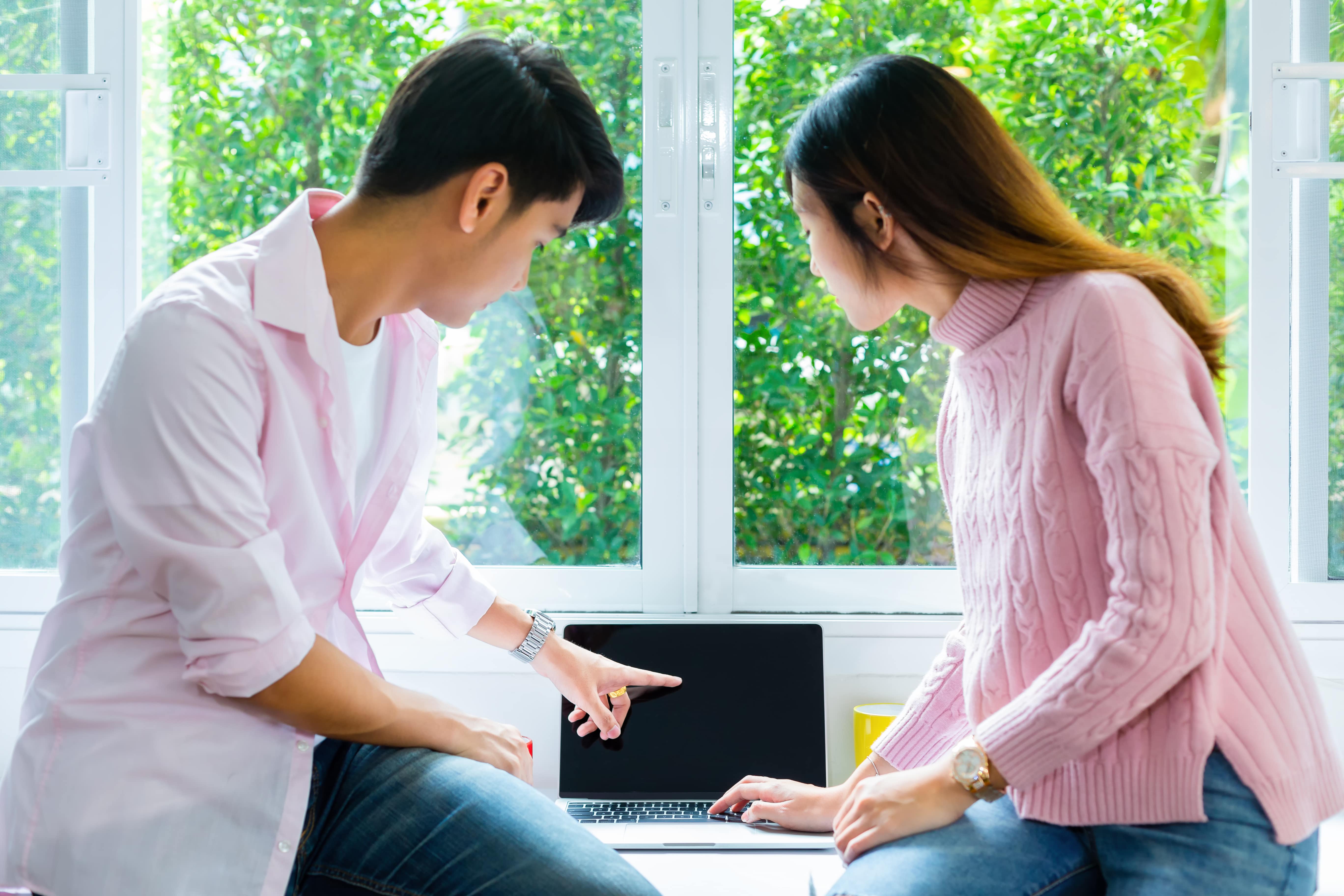 young-teenagers-working-with-laptop-together-min.jpg