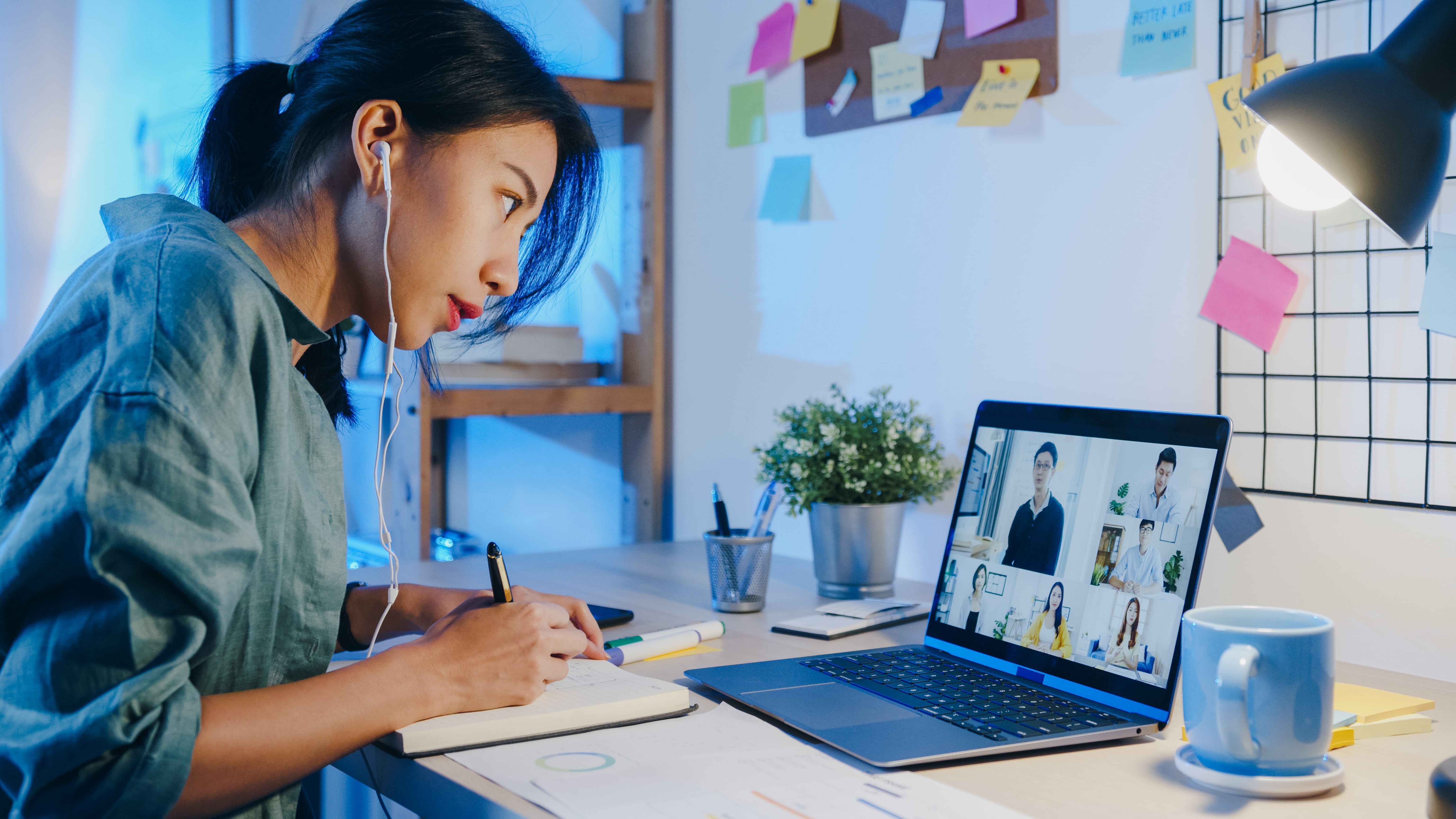 asia-businesswoman-using-laptop-talk-colleagues-about-plan-video-call-meeting-living-room (1)-min.jpg
