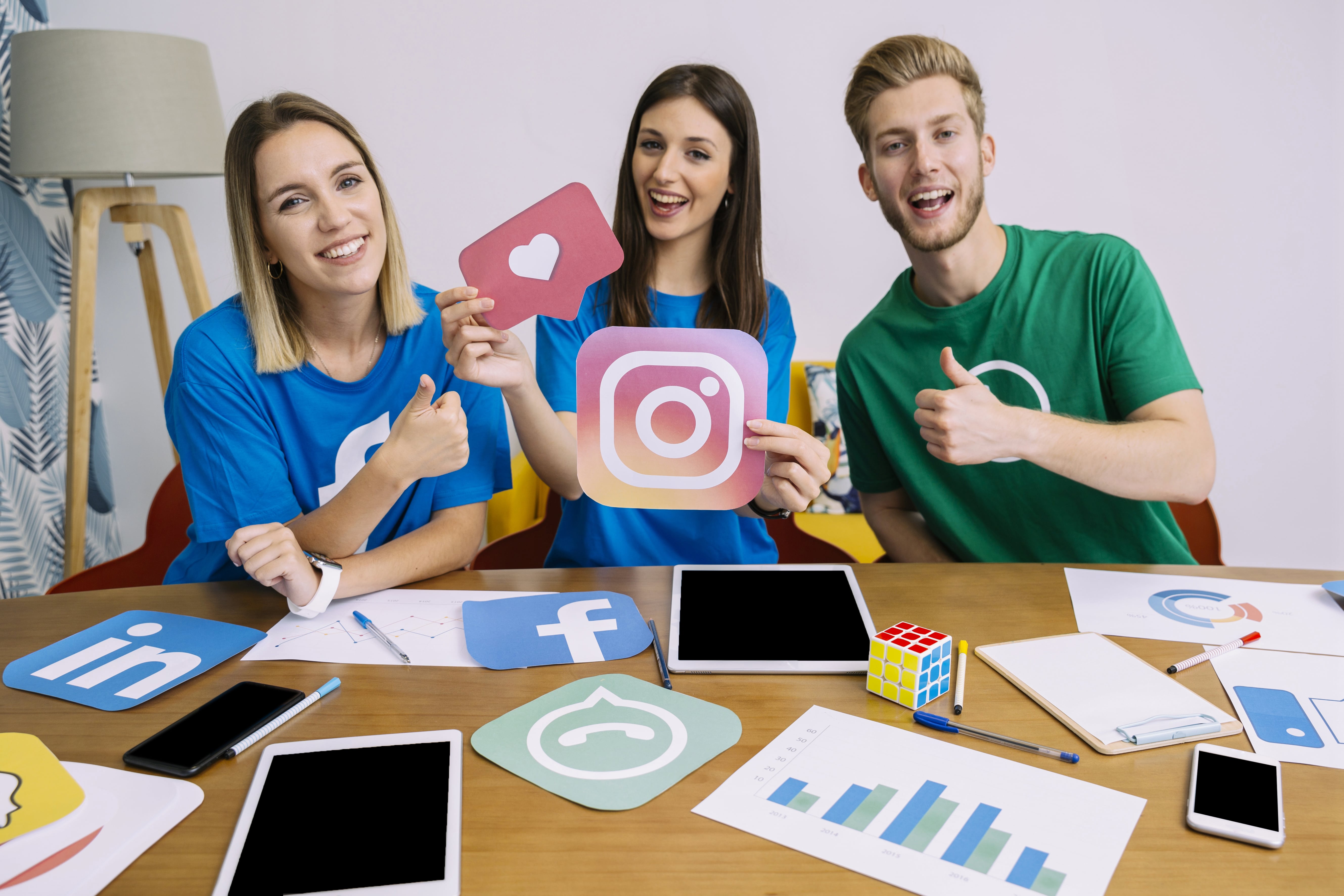 woman-holding-snapchat-logo-with-his-friends-showing-thumbup-sign-min.jpg